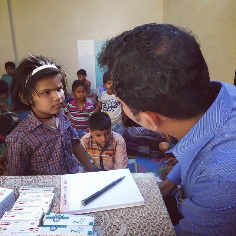 doctor checking student at ngo